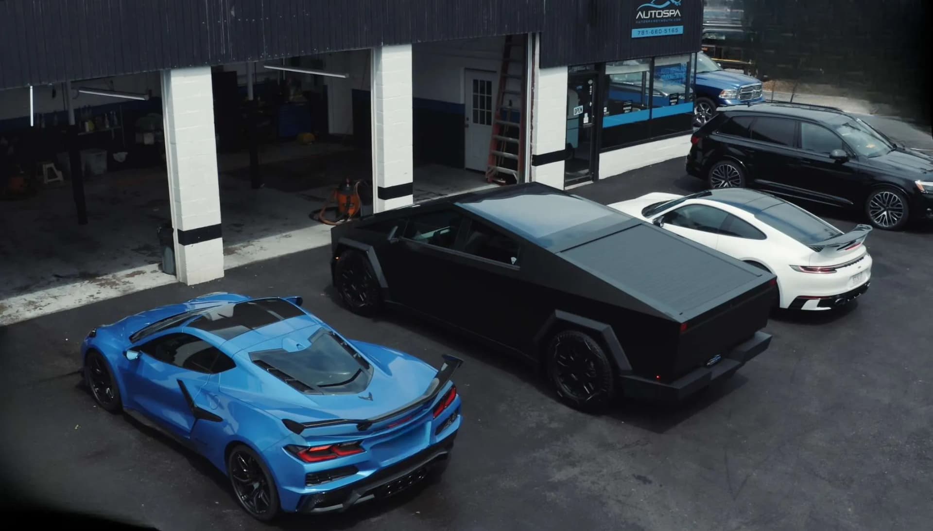 AutoSpa Weymouth location with Corvette and Cybertruck